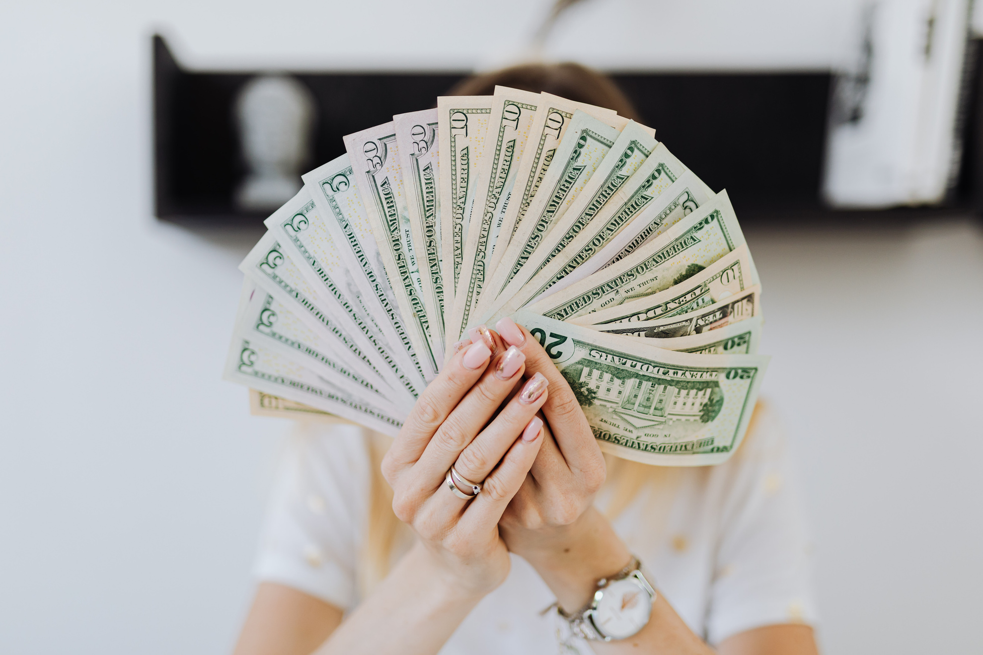 Person Holding Fan of Us Dollar Bills