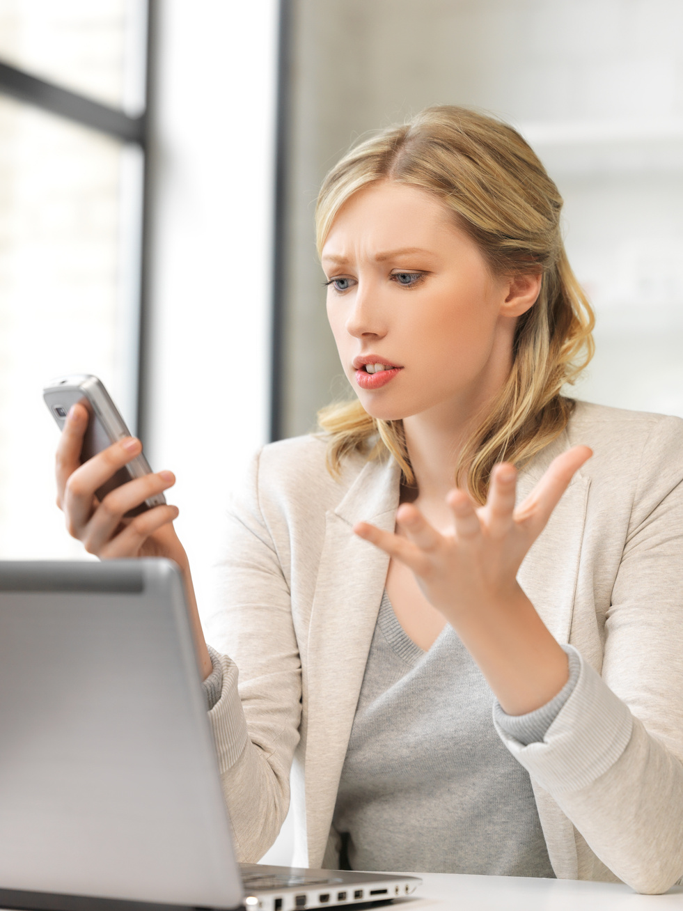 Confused Woman with Cell Phone